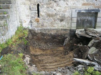 Removal of concrete slab/floor of extension to W side of building