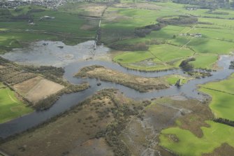 Oblique aerial view showing the flooding along the River Dee at Threave Castle, looking SE.