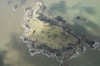 Oblique aerial view of Barlocco Isle and the clearance cairns, field banks and rig, looking NE.
