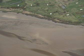 Oblique aerial view of the Eastriggs stake nets, looking N.