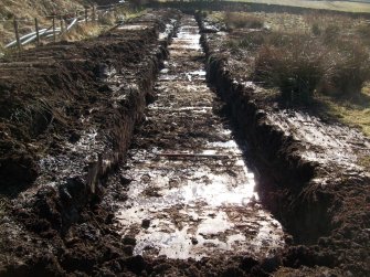 Trench section running NW-SE (in field to north of Scheduled Monument) for watching brief at Barburgh Mill Quarry Extension