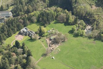Oblique aerial view of Corra Castle and Corehouse Country House, looking ESE.