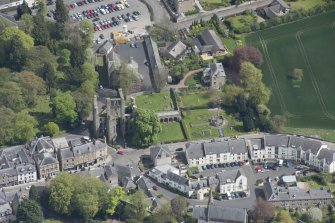 Oblique aerial view of Kelso Abbey and War Memorial, looking ENE.