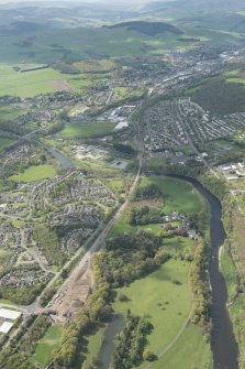 Oblique aerial view of Galashiels, Redbridge Viaduct and construction of the Hawick to Edinburgh Branch Line, looking NW.