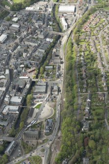Oblique aerial view of Galashiels, and construction of the Ladhope Vale section of the Hawick to Edinburgh Branch Line, looking NW.