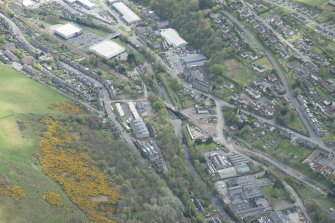 Oblique aerial view of Galashiels, and construction of the Plumtreehall section of the Hawick to Edinburgh Branch Line, looking SSE.