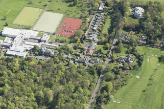 Oblique aerial view of Old Ravelston House, Ravelston House walled garden and the Mary Erskine School, looking SE.