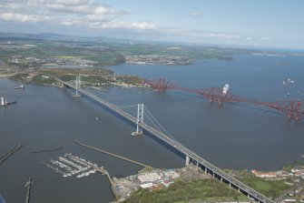 Oblique aerial view of the Forth Bridge, Forth Road Bridge and  construction of the Queensferry Crossing, looking NE.