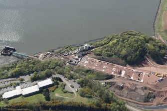 Oblique aerial view of the construction of the Queensferry Crossing on the south bank of the River Forth, looking WSW.