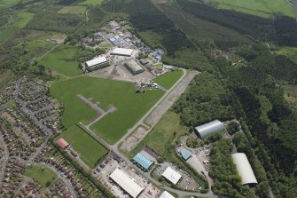 Oblique aerial view of Heathhall Airfield, looking SE.