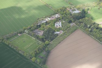 Oblique aerial view of East Fortune Airfield recreation area and Gilmerton House, looking NW.