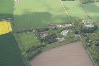 Oblique aerial view of East Fortune Airfield recreation area and Gilmerton House, looking W.