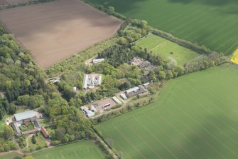 Oblique aerial view of East Fortune Airfield recreation area and Gilmerton House, looking ESE.