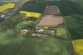 Oblique aerial view of East Fortune Airfield recreation area and Gilmerton House, looking E.