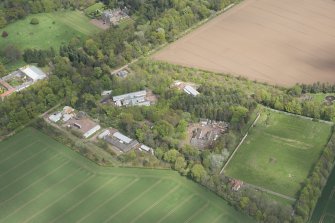 Oblique aerial view of East Fortune Airfield recreation area and Gilmerton House, looking NNE.