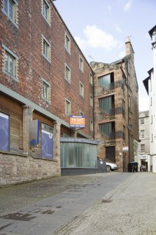 View of NE elevation of Cooper's Close, 114-120 Canongate, Edinburgh, from SE.
