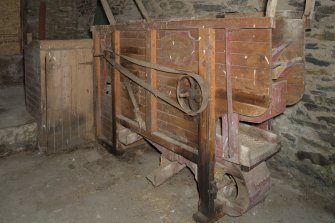 Barn, ground floor, view of threshing machine