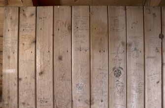 Barn, 1st floor, granary, detail of graffiti on wooden door