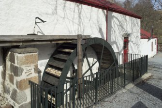 Main mill building (extended 1870s and 1890s), view of waterwheel and lade