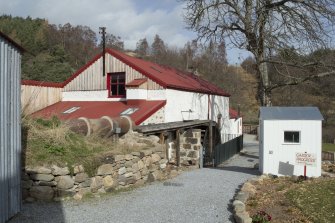 Main mil building  and wooden hut, view from south west