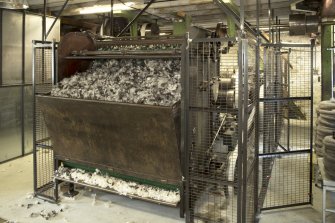 Interior. Main mill building, view of Scribbler (Patent Automatic Feeding Machine, 1919, made in Rochdale). This feeds the Doffer or carding engine behind