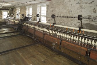 Interior. Main mill building, view of spinning mules (Platt Brothers, Oldham, c.1870)