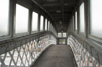 Interior, view along walkway of footbridge from East.