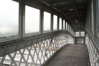 Interior, view along walkway of footbridge from East.