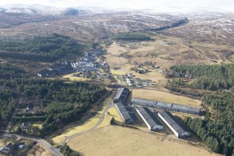 General oblique aerial view of Tomatin Distillery, looking SW.