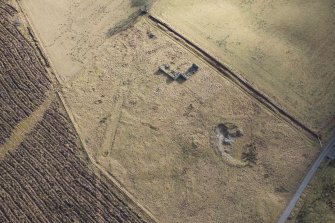 Oblique aerial view of the remains of a farmstead at Moymore, looking SE.