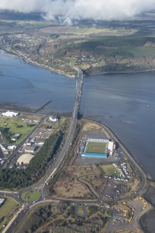 General oblique aerial view of the Kessock Bridge and Caledonian Stadium Football Ground, looking NW.