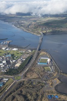 General oblique aerial view of the Kessock Bridge, Caledonian Stadium and Longman Industrial Estate, Inverness, looking NW.