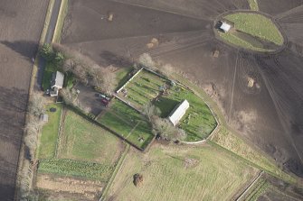 Oblique aerial view of Birnie Parish Church and cemetery, looking NE.