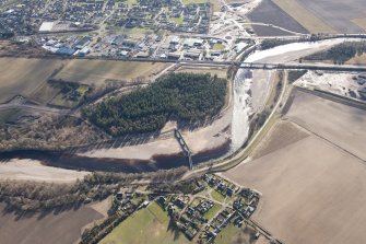 General oblique aerial view of Broom of Moy, Findhorn Railway Viaduct and Forres Industrial Estate, looking S.