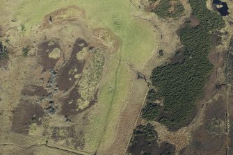 Oblique aerial view of the remains of a farmstead at Big Burn near Balvonie of Leys, looking NE.