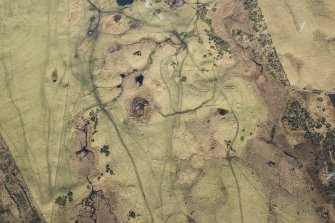 Oblique aerial view of hut circles, rig and field system at Achvraid, looking NNE.