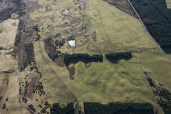 Oblique aerial view of Achvraid and Drumossie Moor field systems and Carn Glas cairns, looking SW.