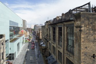 View looking east along Renfrew Street showing the first damaged Mackintosh building and the Reid building opposite, taken from the roof of the Bourdon building.