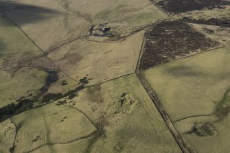 Oblique aerial view of the lime kiln and quarries, looking ENE.