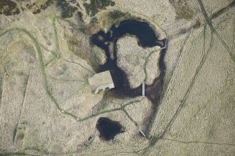 Oblique aerial view of the lime kiln and quarry, looking E.