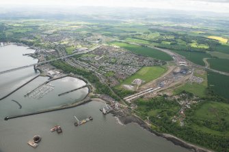 Oblique aerial view of the construction of the new Queensferry Crossing and Port Edgar, looking SE.