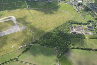 Oblique aerial view of the former site of Hallyards Castle, looking SSE.