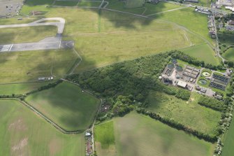 Oblique aerial view of the former site of Hallyards Castle, looking SE.