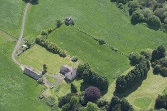 Oblique aerial view of the site of Hatton House, looking SE.