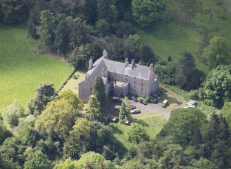 Oblique aerial view of Calder House, looking SW.