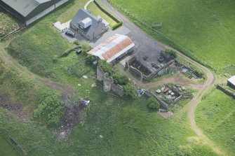 Oblique aerial view of Kipps Farmhouse and Kipps Tower, looking SE.