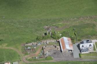 Oblique aerial view of Kipps Farmhouse and Kipps Tower, looking N.