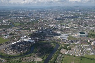 Oblique aerial view of the Commonwealth Games Village, Celtic Park and Emirates Arena, looking WNW.