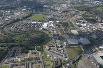 Oblique aerial view of the Commonwealth Games Village, Celtic Park and Emirates Arena, looking WNW.