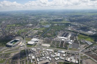 Oblique aerial view of the Commonwealth Games Village, Celtic Park and Emirates Arena, looking SE.